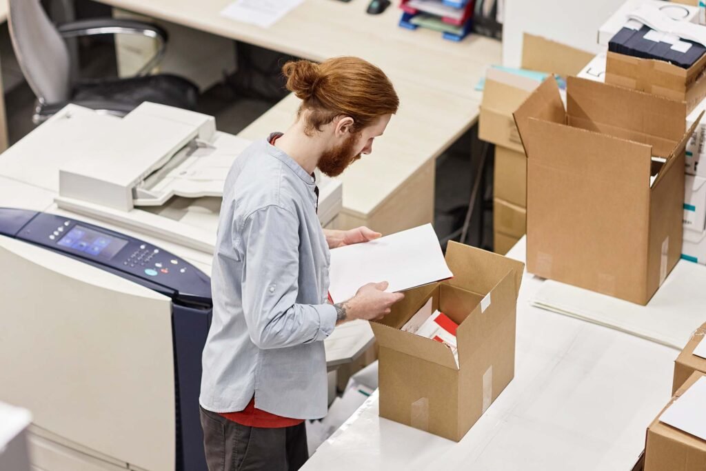 packing-boxes-at-print-factory-PFT8KCM.jpg